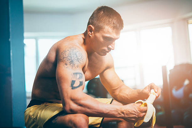 body builder eating banana